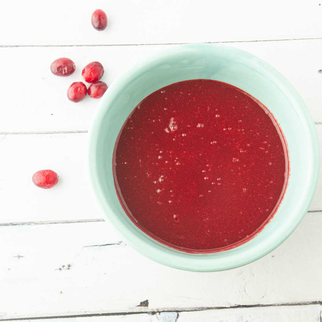 glossy cranberry curd in bowl