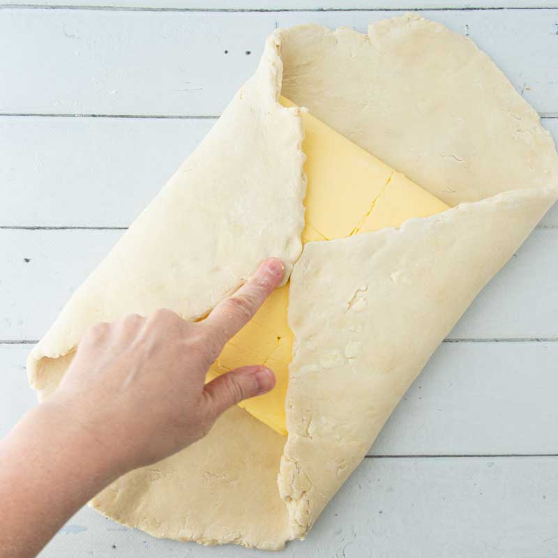 encasing butter block in dough for puff pastry