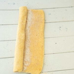 rolling up puff pastry for palmiers