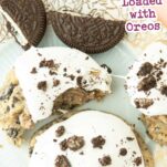 cookies and cream cookies on plate, one showing pull on marshmallow frosting, oreo halves on plate, text overlay