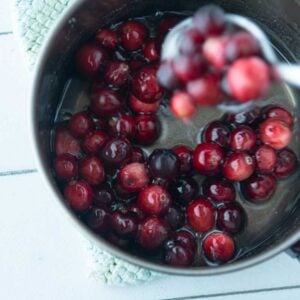 tossing cranberries in simple syrup