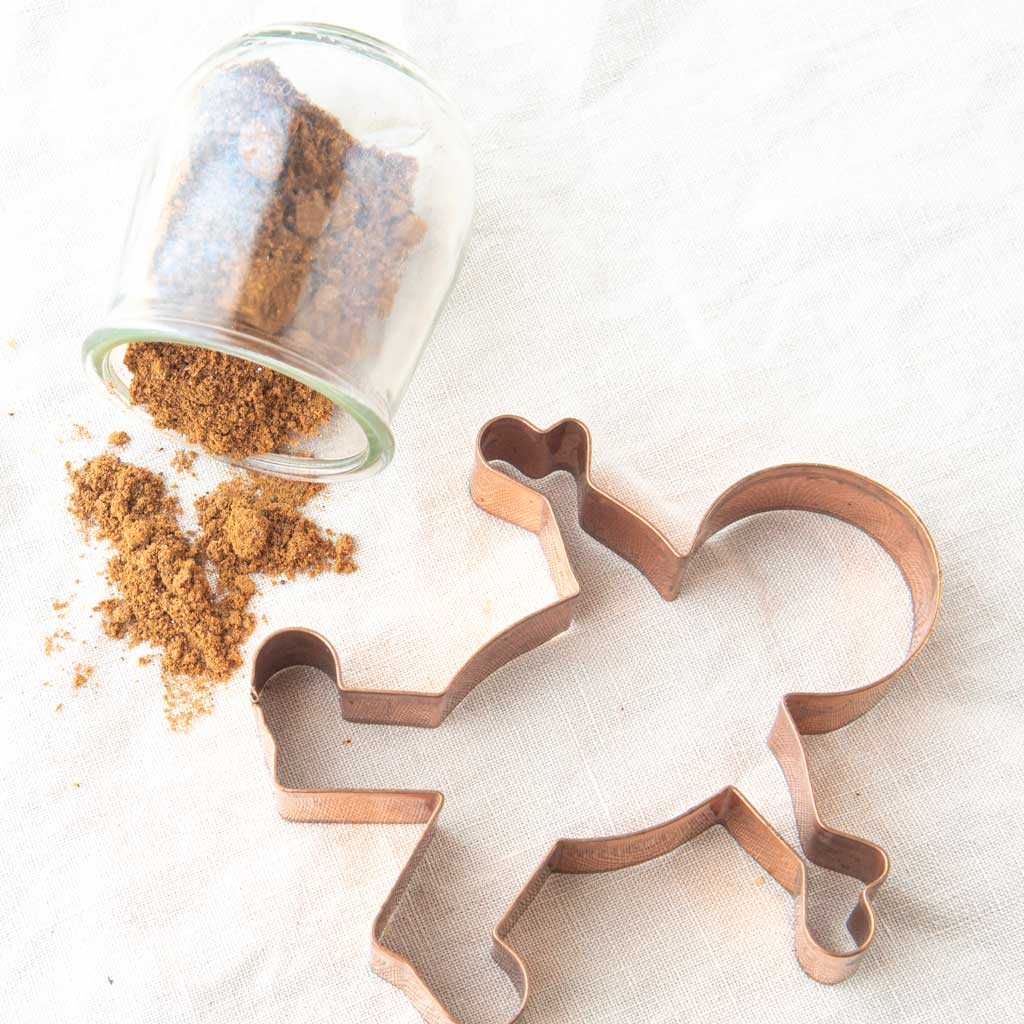 gingerbread spice in jar with gingerbread man cookie cutter