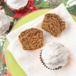 sliced gingerbread muffin on plate with whole gingerbread muffins