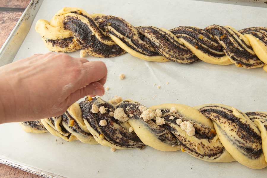 sprinkling streusel on top of babka