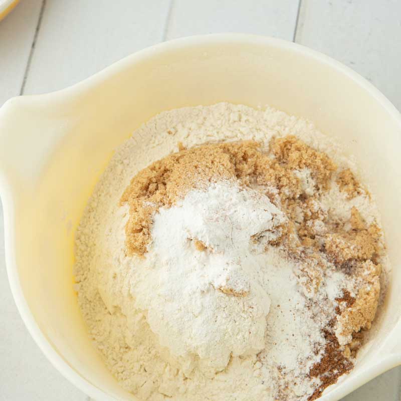 mixing dry ingredients for baked cinnamon sugar donuts