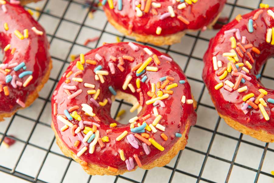 closeup of blackberry glazed donuts