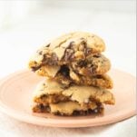 chocolate chip cookie halves stacked on plate