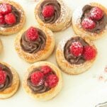 closeup of raspberry chocolate vol au vents on plate