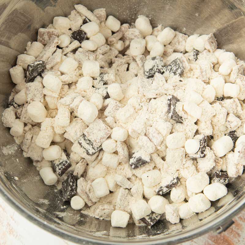 mixing dark chocolate and marshmallows into flour