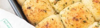 closeup of garlic bread rolls in pan