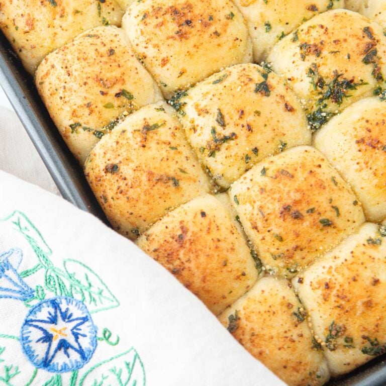 closeup of garlic bread rolls in pan