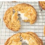 pulling marshmallow crispy cookies apart on a wire rack, text overlay