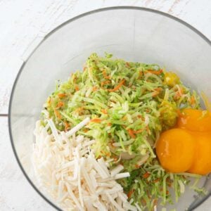 egg yolks, steamed broccoli slaw, cheese shreds in food processor