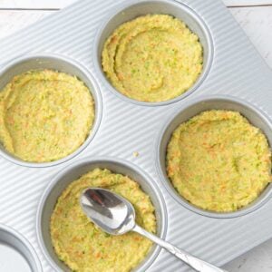 smoothing broccoli crust batter into pan