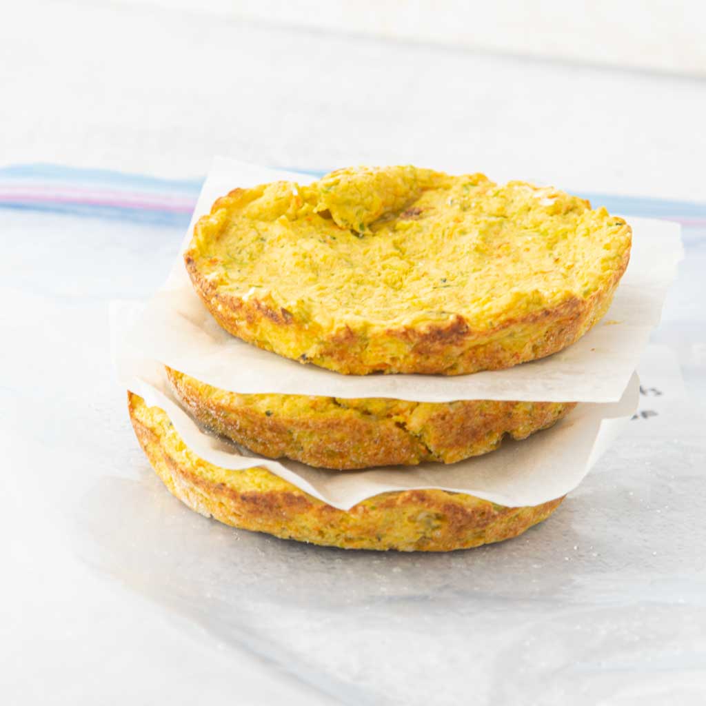 stack of broccoli pizza crusts for freezer