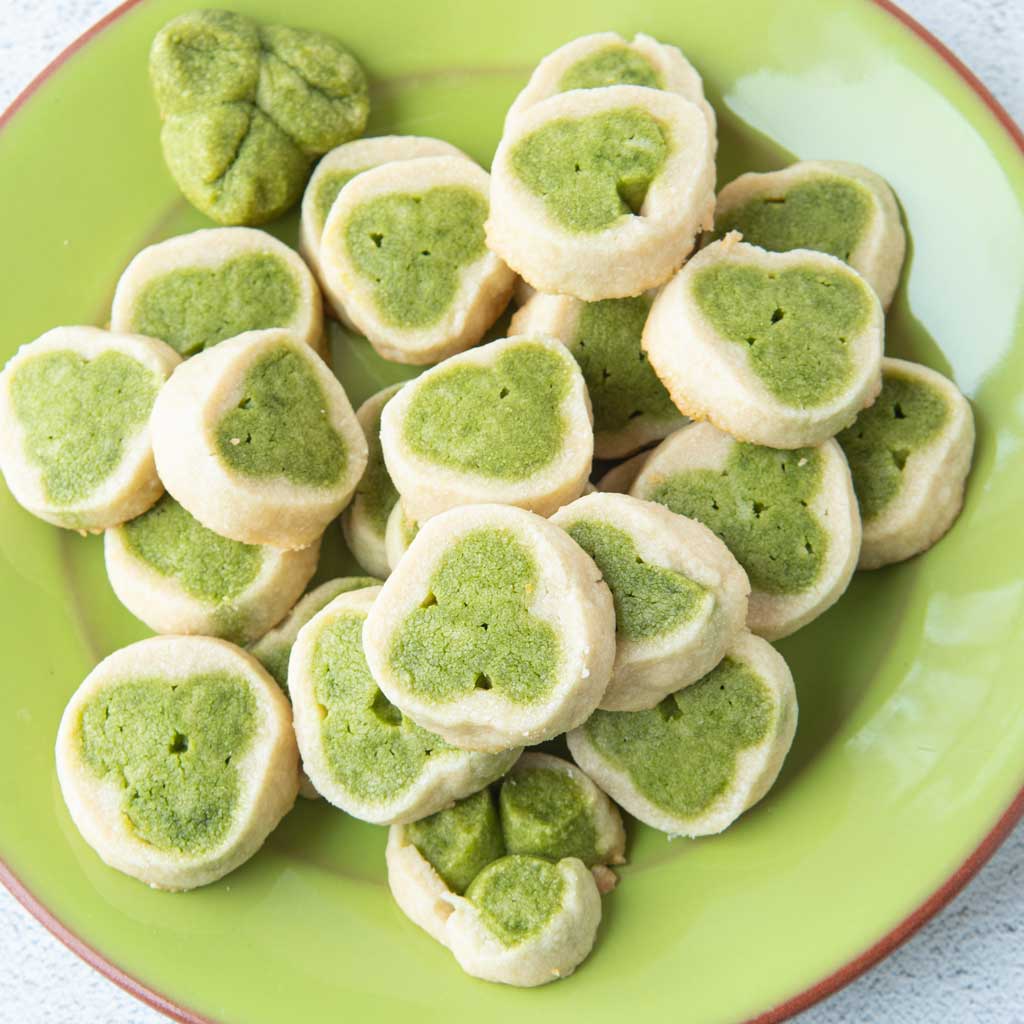 shamrock cookies on green plate