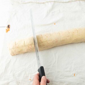 marking cinnamon roll log for cutting