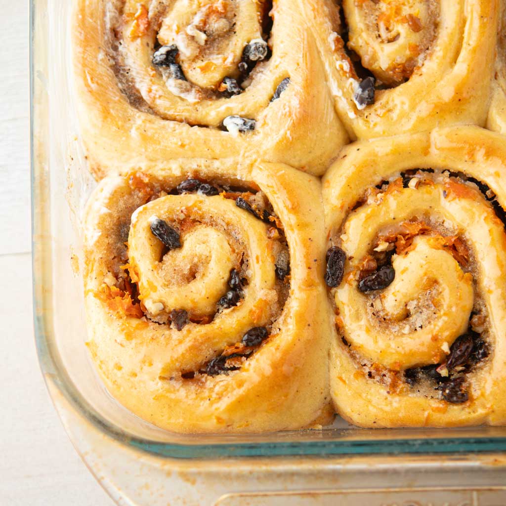 closeup of carrot cake cinnamon rolls before icing