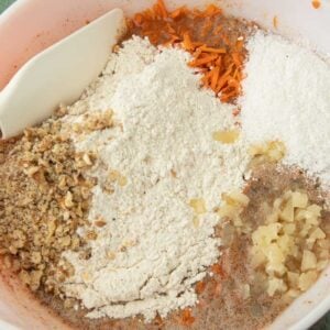 flour and mix ins added to carrot cake batter