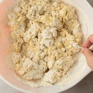 stirring dough together in bowl