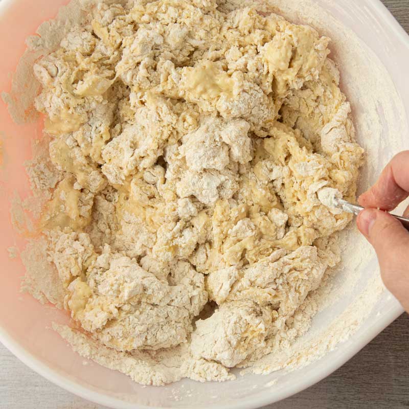 stirring dough together in bowl