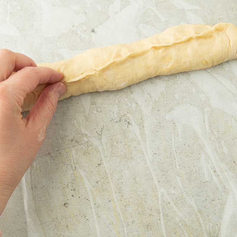 pinching bottom of hoagie bun seam