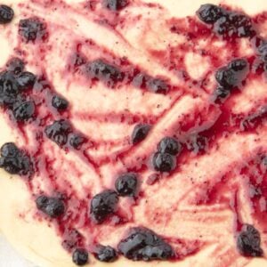 blueberry jam spread on dough