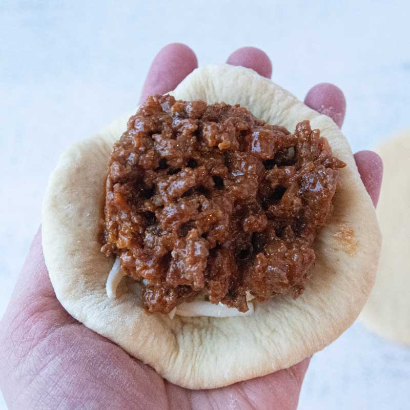 sloppy joe filling on top of bread dough