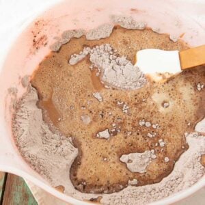 adding beer and wet ingredients to batter