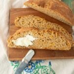 slices of beer cheese bread, one with butter slathered on it, text overlay