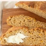 slices of beer cheese bread, one with butter slathered on it, text overlay, text overlay