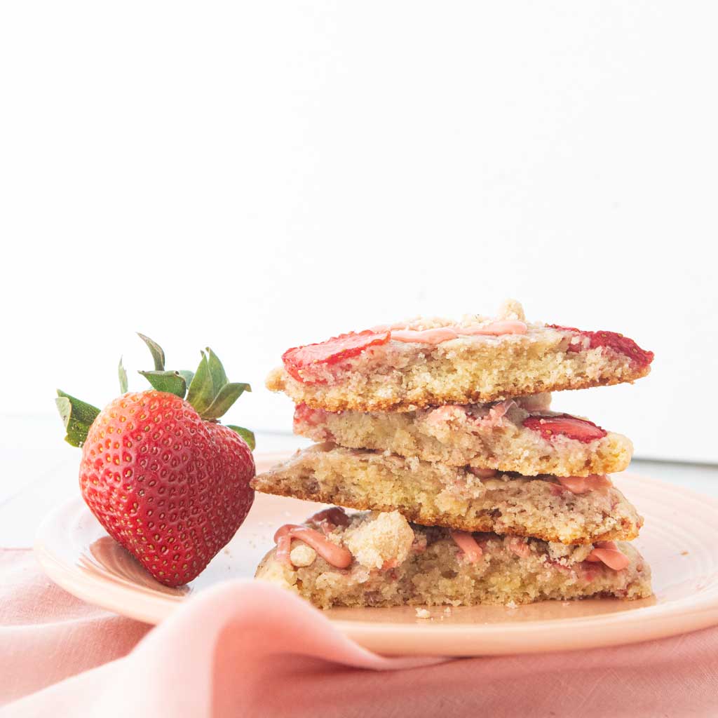 stack of broken halves of strawberry shortcake cookies
