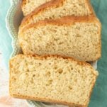 stack of slices of english muffin bread laying in plate, text overlay