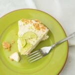 top view of frozen key lime pie on plate with fork