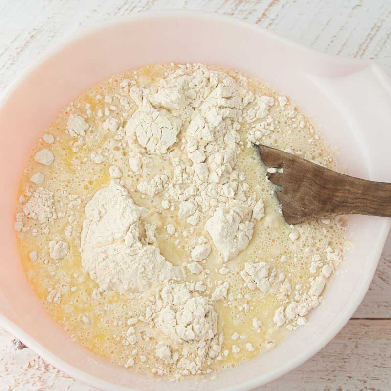 mixing ingredients together for English muffin bread
