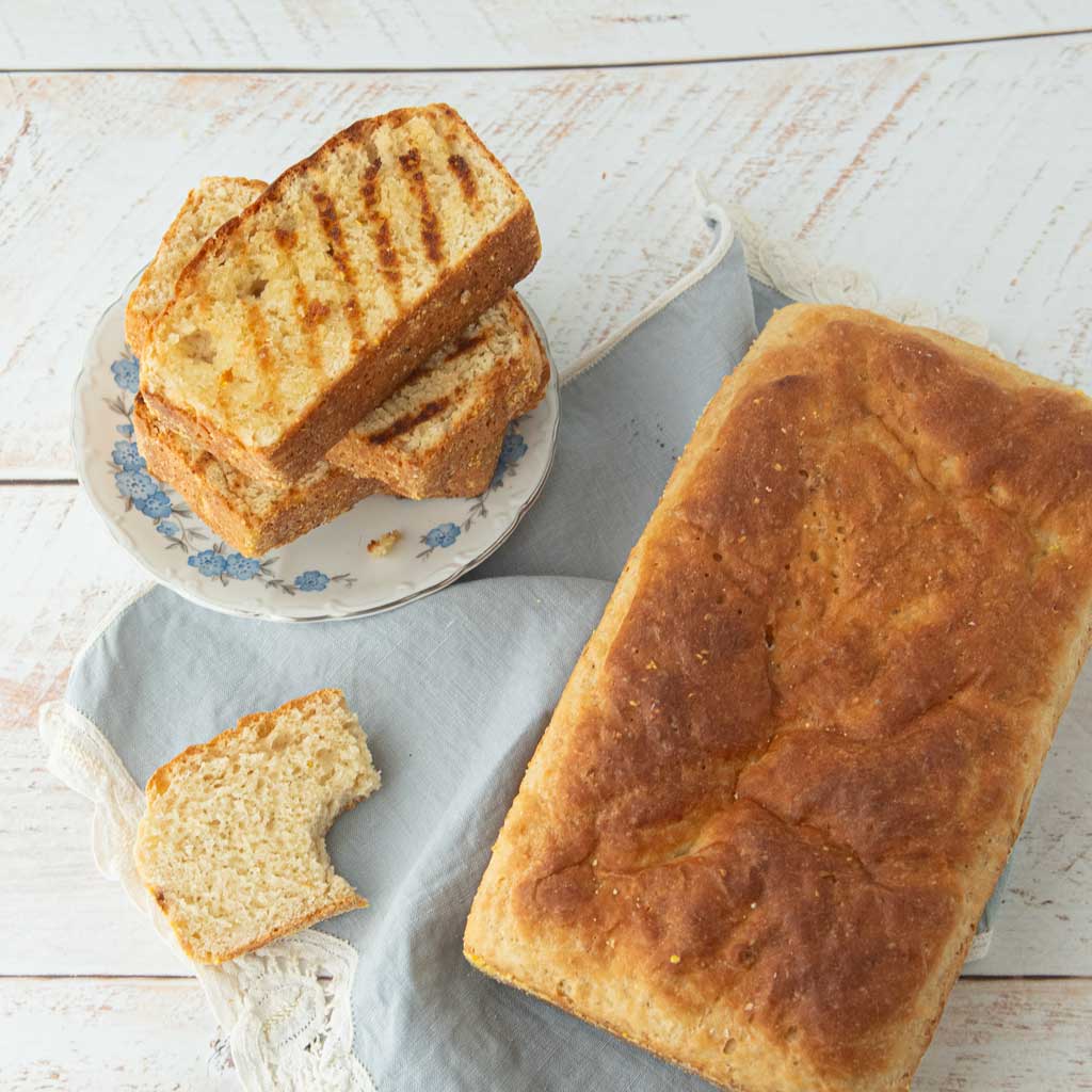 grilled slices of bread, slice of bread with bite out of it and loaf of English muffin bread