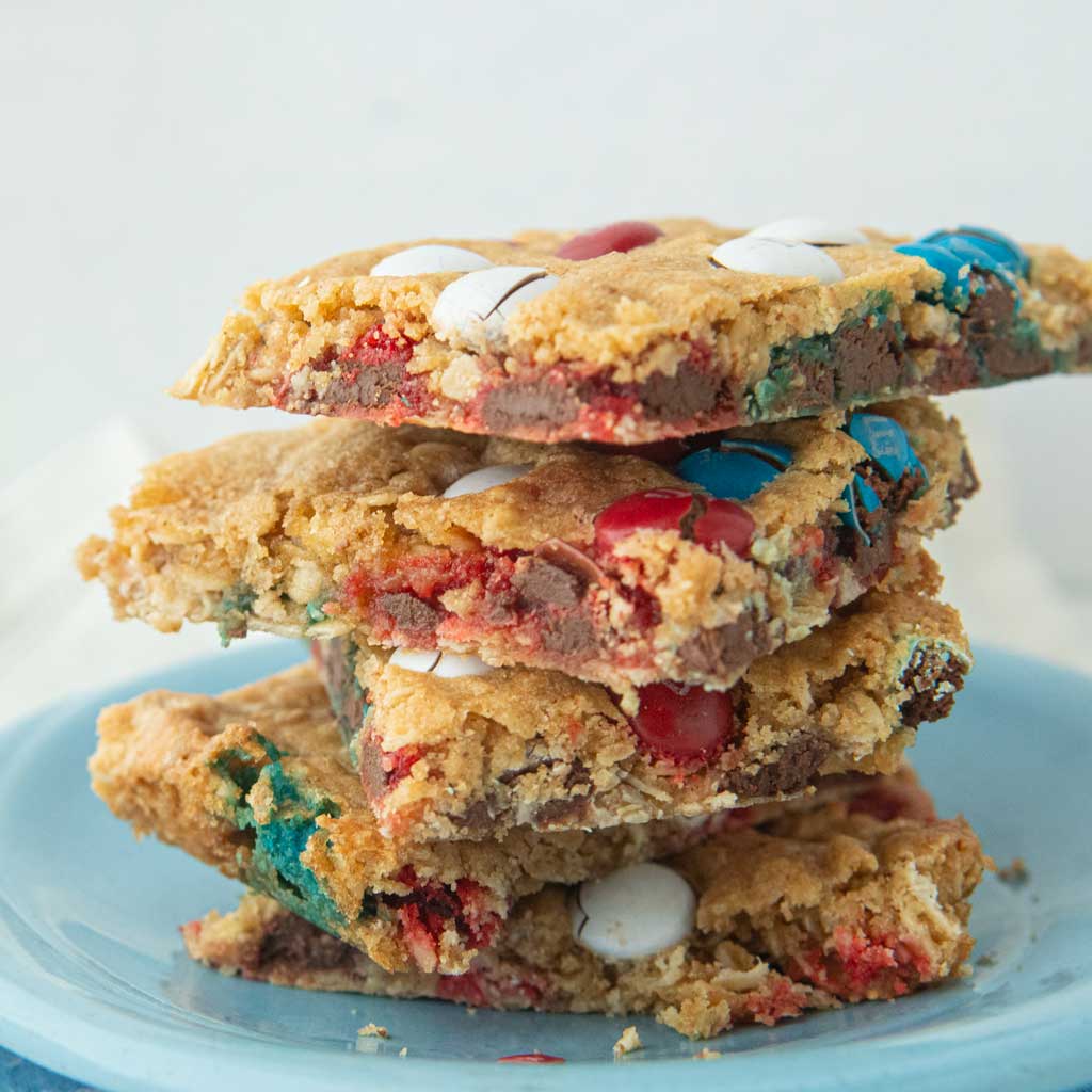 side closeup of m&m cookie bars on plate