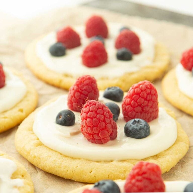 closeup of fruit pizza cookies topped with berries