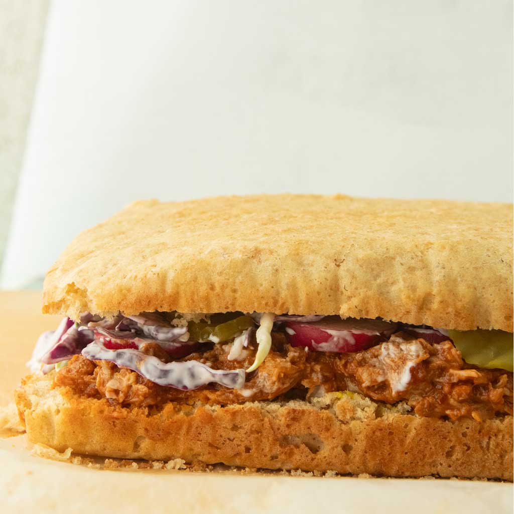 sandwich bread stuffed with bbq pork and coleslaw
