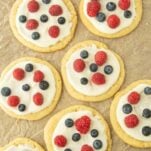 top view of fruit pizza cookies topped with berries, text overlay