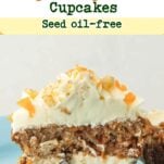 cross-section of carrot cake filled with cream cheese frosting and dome of cream cheese frosting on top, text overlay