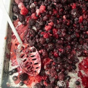 mixed berry filling on sheet tray with spoon