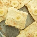 banana pudding pie on server on tray of banana pudding pie