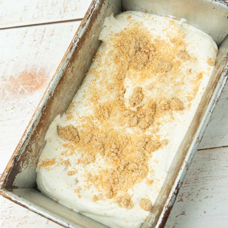 sprinkled crumb topping over ice cream