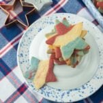 star cookie cutters, red white and blue tablecloth, red white and blue star cookies on plate
