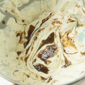 swirling rum butter syrup into ice cream base
