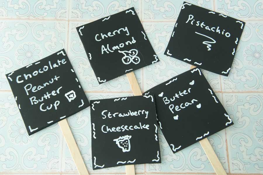 small signs for ice cream flavors on popsicle sticks