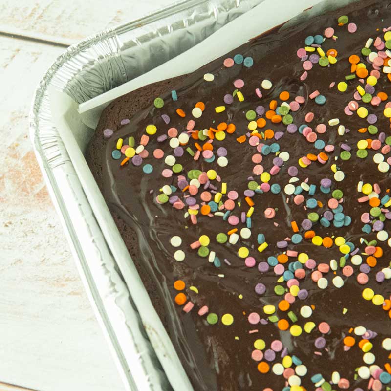 cosmic brownies in pan with confetti sprinkles