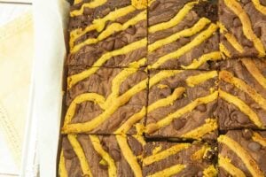 closeup of the top of lines of pistachio butter baked into pistachio brownies