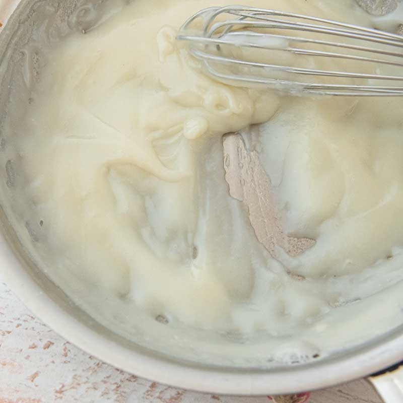 cooked roux for ermine frosting recipe and whisk in skillet